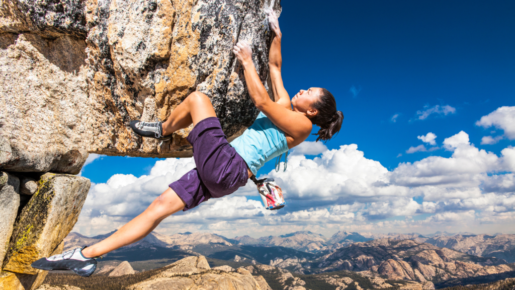 Woman climbing mountain