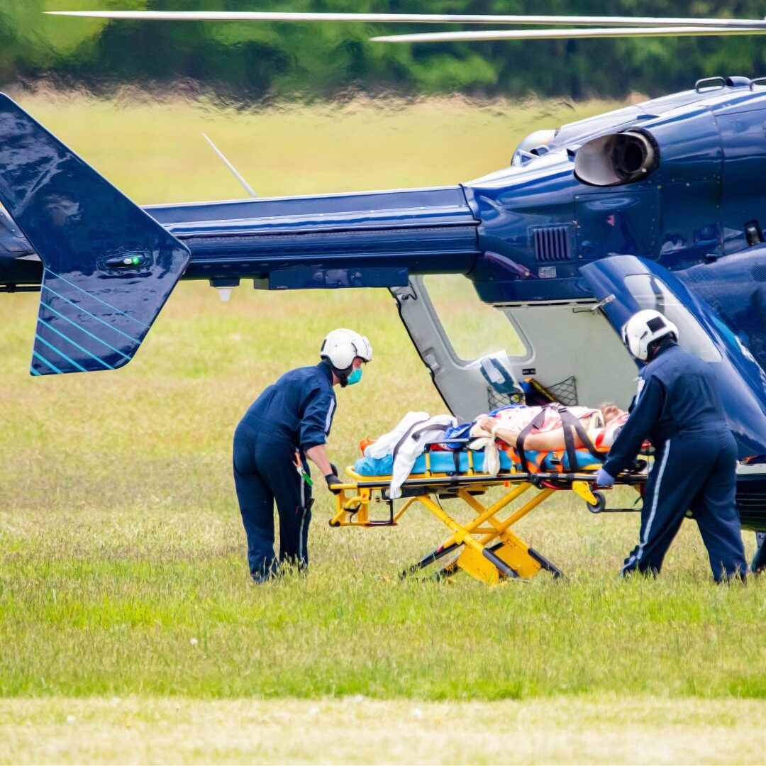 wilderness-medevac-heli Search & rescue team in mountains moving victim to medevac helicopter AWMLS