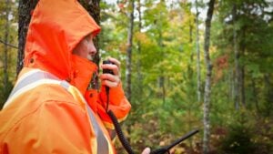 Search and rescue team member talking on a radio
